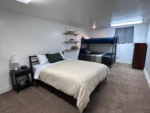 a bedroom with a bed and a bunk bed at Sunny Days in Pocatello