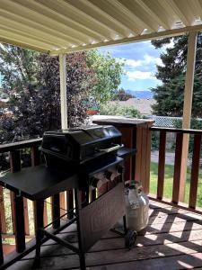a grill sitting on a screened porch with a view at Sunny Days in Pocatello