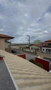 a roof of a building with a parking lot at Navega Praia Casa in Navegantes +13 photos