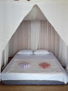 Postel nebo postele na pokoji v ubytování Parfray Homestay Raja Ampat