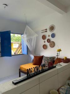 a room with a bed on top of a counter at Vila Flor in Cairu