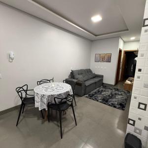 a living room with a table and a couch at VivaVida Imperial 103 in Sinop