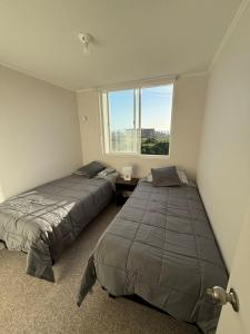 Postel nebo postele na pokoji v ubytování Amanecer del Faro + 18 fotografií