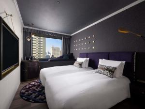 Postel nebo postele na pokoji v ubytování Mercure Tokyo Hibiya