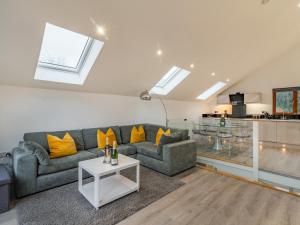 a living room with a couch and a table at Waterside Lodge in Elland