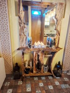 a dressing table with a mirror and boots on it at Rooftop terasse azur essaouira in Essaouira +9 photos