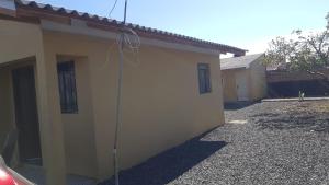 a side view of a house with a building at Pousada da Lu in São Francisco do Sul +14 photos