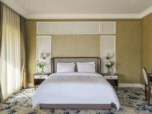 Postel nebo postele na pokoji v ubytování Rixos Bab Al Bahr - Ultra All Inclusive