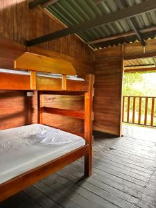 a bedroom with a bunk bed in a cabin at Casa Cachalote in El Valle