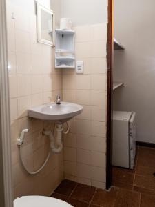 a bathroom with a sink and a toilet at Recanto D'Ajuda in Arraial d'Ajuda