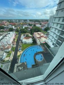 a view of a swimming pool on top of a building at TOKAYOH D Khadijah in Kota Bharu +3 photos