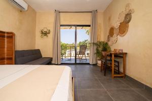 Postel nebo postele na pokoji v ubytování Villavida Boutique Hotel - La Playita