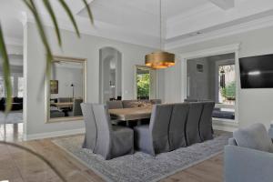 a dining room with a table and chairs at La Rinconada Place in Redding