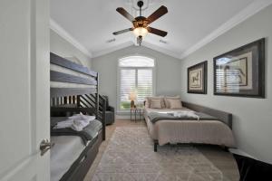 a bedroom with two beds and a ceiling fan at La Rinconada Place in Redding