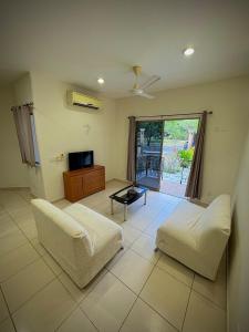 Μια τηλεόραση ή/και κέντρο ψυχαγωγίας στο Depa 101B en Huatulco con alberca y balcón a 5 min playa