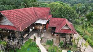 an overhead view of a house with red roofs at Diindanghomestay in Ban Khao Klom +2 photos