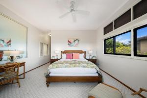 a bedroom with a bed and a window at Kapalua Ridge Villas 1011 · KRV 1011 Oceanview Condo + Golf + Lu in Kahana +45 photos