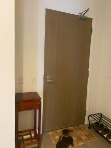 a door in a room with a table and a desk at Cozy holiday home in Toronto +9 photos