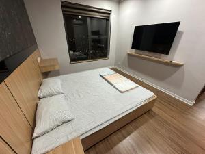 Μια τηλεόραση ή/και κέντρο ψυχαγωγίας στο Binh Minh Garden Relax Apartment