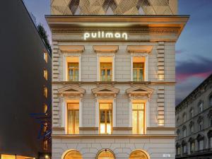 a building with a sign on the side of it at Pullman Budapest in Budapest