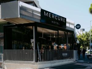 a store with a sign that reads mercure hotel at Mercure Brisbane Spring Hill in Brisbane