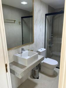 a bathroom with a sink and a toilet at La Gabbanee Hotel Boutique in Fernando de la Mora