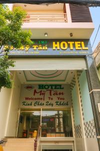 a hotel sign on the front of a building at Mỹ Tân Hotel HCM in Ho Chi Minh City +12 photos