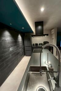 a kitchen with a stainless steel sink in a kitchen at AWAJI OCEAN BASE east coast in Awaji
