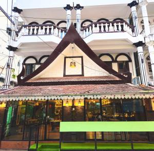 a building with a sign in front of it at Beach Comber in Ban Nong Chaeng +4 photos