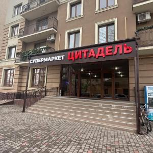 a entrance to a building with a sign on it at Квартира,Еврейская,1 in Bilhorod-Dnistrovskyi