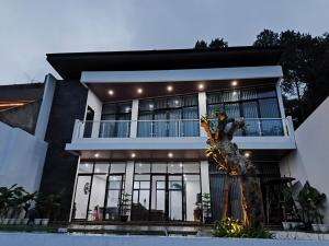 a building with a statue in front of it at Kintamani Hills in Cilama