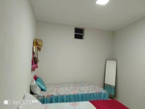 a bedroom with a bed and a mirror at Casa com piscina e área gourmet em Arembepe in Camaçari +17 photos