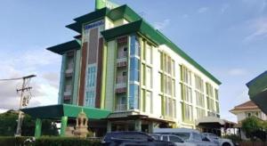 a building with cars parked in front of it at Chodkamol Place 57 in Nakhon Si Thammarat