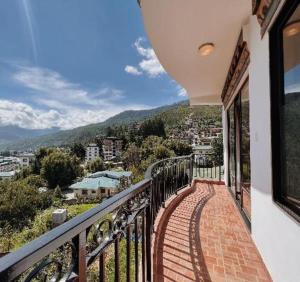 a balcony with a view of a city at Khang Residency Thimphu in Thimphu