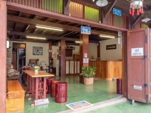a large room with a table in a building at BankongRimkhong Chiangkhan in Chiang Khan