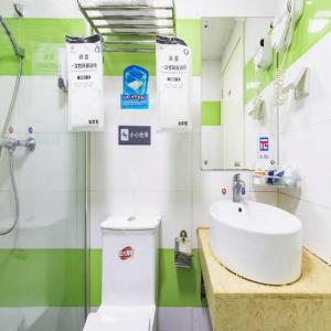 a bathroom with a sink and a toilet and a mirror at PAI Hotel·Chengdu Jinsha Museum Metro Station in Chengdu +95 photos