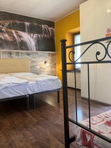 Ένα ή περισσότερα κρεβάτια σε δωμάτιο στο Albergo Garni Barancio +4 φωτογραφίες