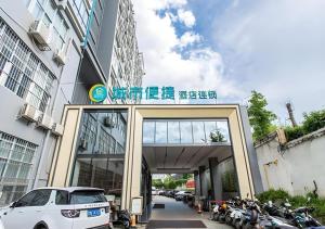 a car is parked in front of a building at City Comfort Inn Nanning Shuangyong Road Guangxi Medical University in Nanning