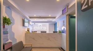 a hospital lobby with a counter in the middle at City 118 Selected Hotel Xi'an Fengcheng Nan Road in Xi'an