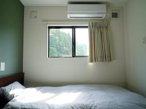 Katil atau katil-katil dalam bilik di トレーラーホテル市原鶴舞インター店
