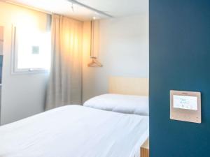 Katil atau katil-katil dalam bilik di Ibis Budget La Rochelle Puilboreau