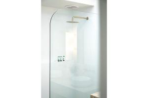 a shower with a glass door in a bathroom at Boomerang Bliss in Elizabeth Beach