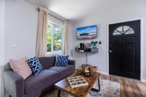 a living room with a couch and a table at Mi Casita-Bungalow Vacation Home in Whittier