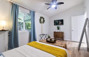 a bedroom with a bed and a ceiling fan at Mi Casita-Bungalow Vacation Home in Whittier +29 photos