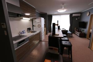 a kitchen with a sink and a counter top at Yasuragi-KAWAGOE 2F in Kawagoe