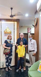 a group of people standing in a room at Hotel Anjana Cottage - Stay 5 min Away From Golden Temple in Amritsar