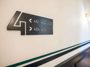 a scoreboard on the wall of a bowling alley at MADISON Saint Jean de Luz - Handwritten Collection in Saint-Jean-de-Luz