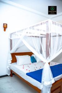 Postel nebo postele na pokoji v ubytování Serendib villa unawatuna