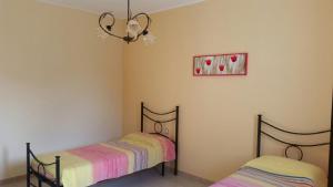 A bed or beds in a room at Villa Cristina