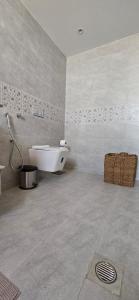 a bathroom with a tub and a sink in a room at Desert Escape Camp Wahiba in Ibrā